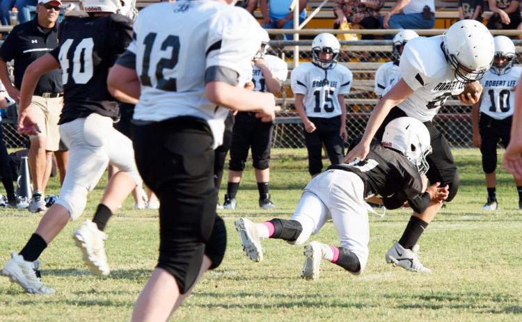 Kade Bannowsky gets horizontal in tackling a Robert Lee ball carrier in a Junior High game earlier this season.